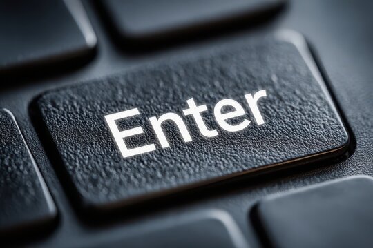 A close-up of a black keyboard button labeled 'Enter' with crisp, white lettering, highlighting its textured surface and essential function in modern computing.