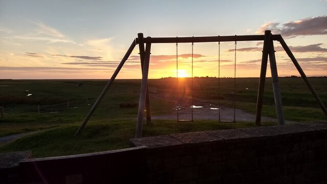 On the hill, by the swings at sunset - England, UK 