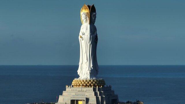 Buddhism Guanyin statue at seaside in nanshan temple, hainan island , China, words mean blessing and mercy