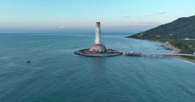 Buddhism Guanyin statue at seaside in nanshan temple, hainan island , China, words mean blessing and mercy