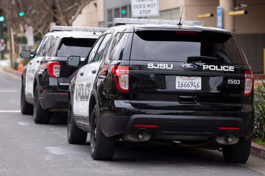 San Jose, California, USA - February 2, 2026: San Jose Sate University police cruisers park outside of the Police Department headquarters.