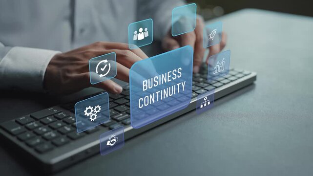Business continuity management concept. Person typing keyboard with risk recovery and operational continuity icons, crisis management, business resilience and organizational stability.