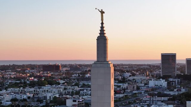 Dusk Aerial of Angel Moroni Statue With Pacific Ocean View