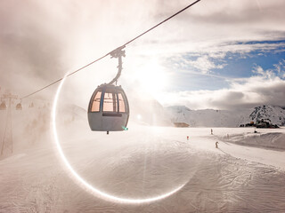 Gondola in Winter Ski Resort Shot Contre‑Jour with Circular Sun Aureola