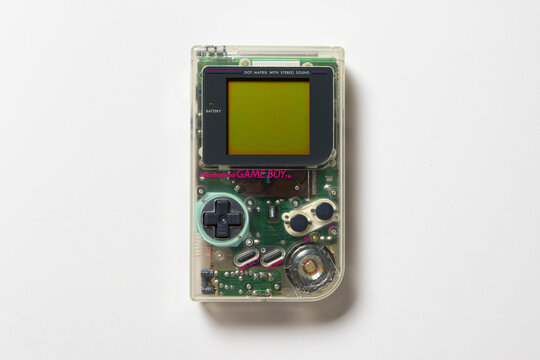 Nintendo Game Boy DMG Play It Loud. The handheld console is transparent and on a white background.