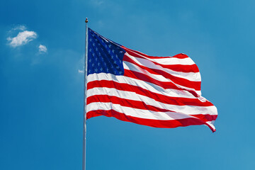 Fototapeta premium United States flag waving in wind symbol of freedom and national pride
