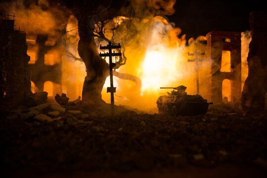 War Concept. Military silhouettes fighting scene on war fog sky background, World War Soldiers Silhouette Below Cloudy Skyline At night. Battle in ruined city.
