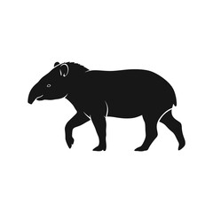 Fototapeta premium Silhouette of a walking tapir in black and white, side view.