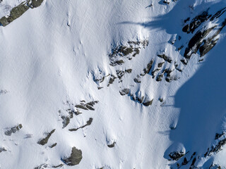 Aerial View Of Snow-Covered Mountain Ridge And Rocky Cliffs In BC, Canada &mdash; Winter Landscape
