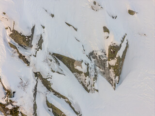 Aerial Winter View Of Snow Covered Rocks And Mountain Slope In BC, Canada