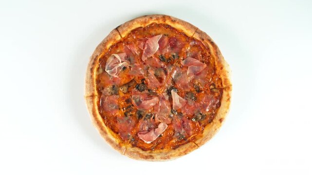 Rotating Fresh Pizza Capricciosa Isolated on White, Endless Loopable Slow Motion Shot.