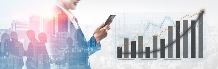 A confident businessman stands in a cityscape, holding a smartphone, with financial growth graphs in the background, symbolizing modern business success. Impute © InfiniteFlow