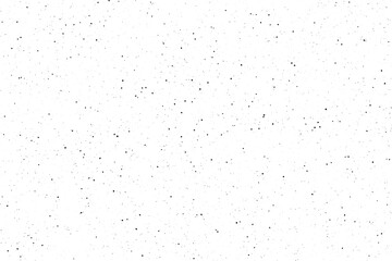 Fototapeta premium Scattered black dots creating a distressed grainy pattern on a clean white surface