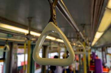 Close-up of handle grip inside a public transport
