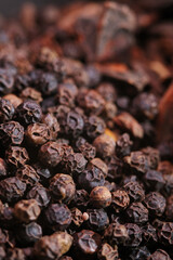 Fototapeta premium close up of black peppercorns