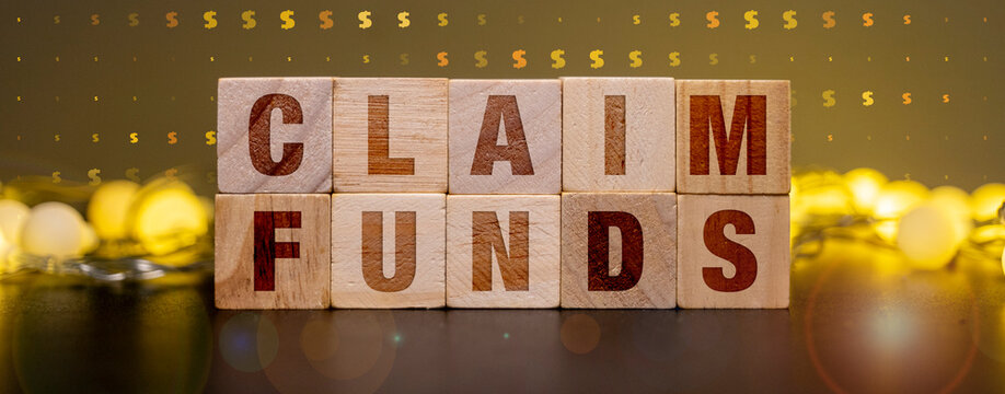 Unclaimed Property Recovery Concept with Claim Funds Text on Wooden Blocks