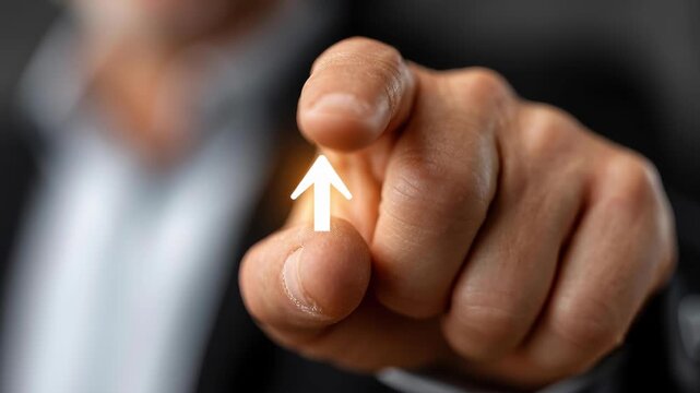 The Guiding Pointer: An up-close shot of a pointing finger, with a minimalist arrow overlay, directs focus and conveys instruction or guidance.