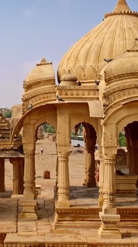 Bada bagh cenotaphs (Hindu tomb mausoleum) made of sandstone in Indian Thar desert. Jaisalmer, Rajasthan, India. Horizontal panning