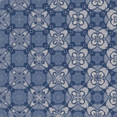 Fototapeta premium A blue and white patterned fabric with a lot of small squares. The squares are all different sizes and shapes