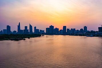 Fototapeta premium Beautiful sunset view of Saigon River seen from Thu Thiem Bridge.