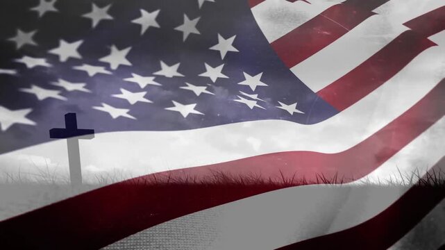 Gusts pushing American flag rippling, reshaping stars and stripes, revealing cross evoking memorial