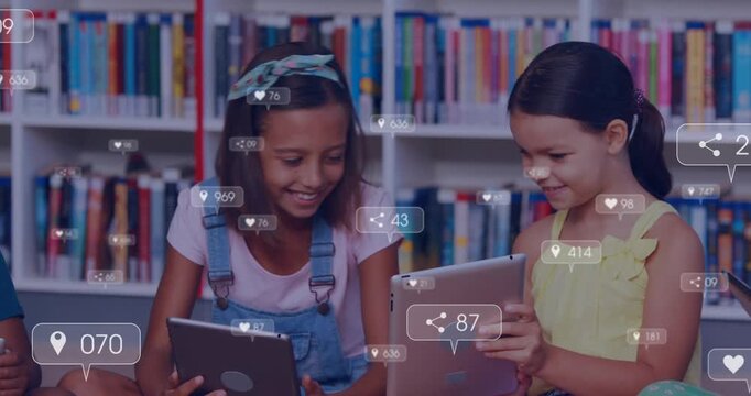 Two girls sharing tablets in school, tapping screens and causing animated bubbles while comparing