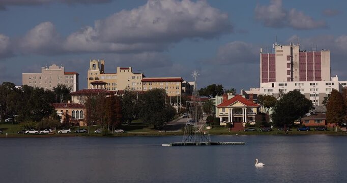 The historic skyline rises above Lake Morton in Lakeland, Florida, USA.