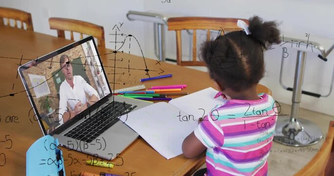Vertical video: Writing girl in striped tee hearing laptop tutor at home with notebook for math
