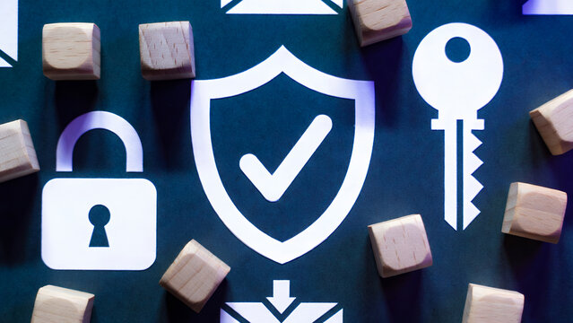 Digital security and data protection concepts are depicted with wooden cubes and icons.