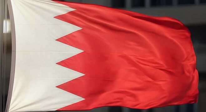 bahrain flag waving in wind with serrated white edge