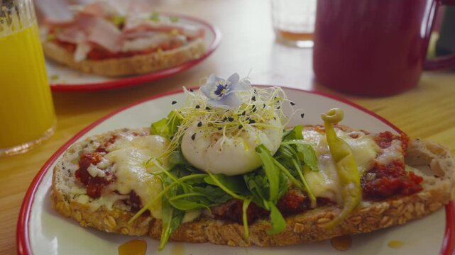 Delicious brunch toast topped with boiled egg in a Mallorca caf&eacute;. Perfect for food blogs or travel vlogs.