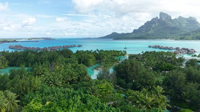 Bora Bora Island, French Polynesia. Revealing Drone Shot of Luxury Tropical Resort and Lagoon