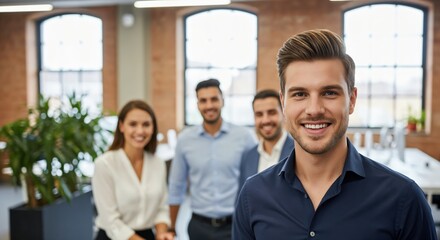 Obraz premium Confident Young Male Entrepreneur Leading Agile Startup Team in Modern Loft Office