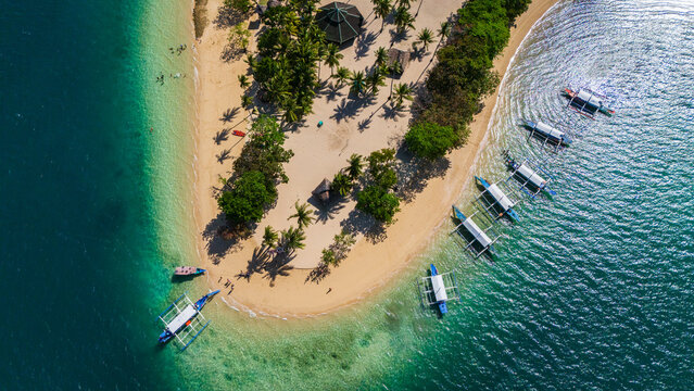 Aeria top donwnl drone shot of the tropical Cowrie Island in Honda Bay, Puerto Princesa, Palawan, Philippines