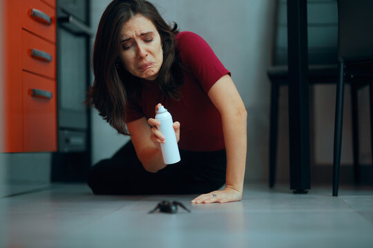 Disgusted Woman Getting Ready to Spray Giant Bug. Lady with insect repellent spray fight the pest on the floor