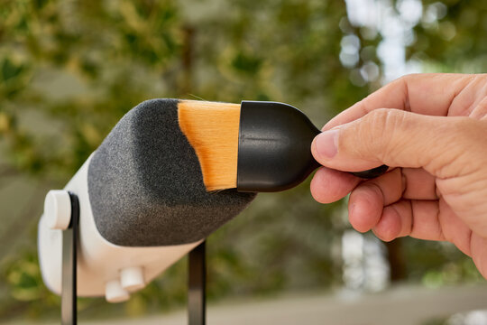 Hand brushing microphone with makeup brush for ASMR trigger sound recording