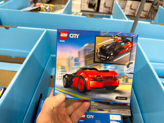 Fototapeta premium LEGO City Red Sports Car Building Toy Set Box Held In Store Toy Section