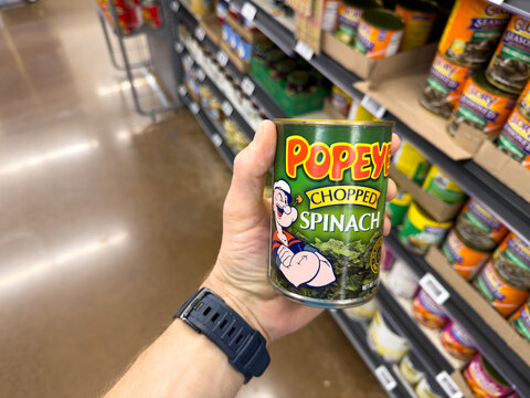 Popeye Chopped Spinach Can Held In Grocery Store Vegetable Aisle