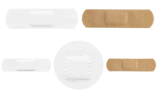 Group of medical adhesive bandages in different shapes and colors, isolated on a transparent background.