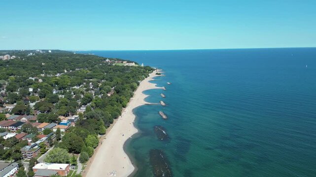 Aerial View of Toronto's Beaches Neighbourhood with Curved Sandy Coves and Deep Blue Lake Ontario
