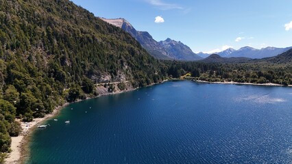 Fototapeta premium Perito Moreno Lake in Bariloche, Argentina, beach and kayaks on deep blue water near Colonia Suiza, Patagonia.