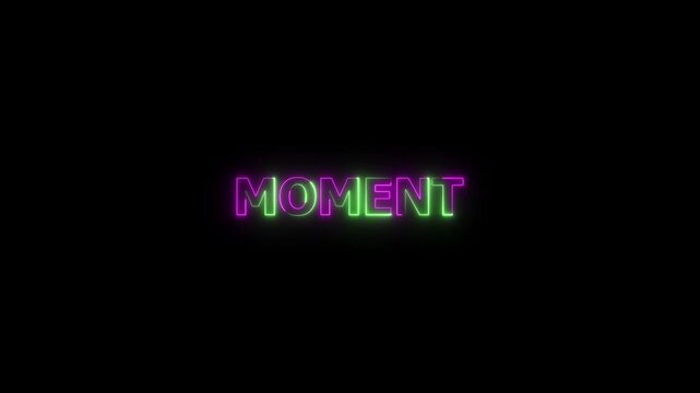 Neon &ldquo;Moment&rdquo; Sign Glowing in Pink and Green on Black Background