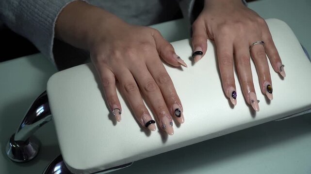 Beautiful young woman&rsquo;s hands with trendy creative manicure