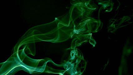 Fototapeta premium Abstract smoke billowing gracefully, a mesmerizing display of colors and forms against a dark backdrop