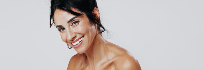 Portrait, skincare and smile of woman on studio space for antiaging cosmetics or dermatology...