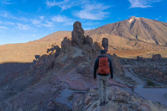 A tourist is viewing the Roques de Garc&iacute;a cliffs in Teide National Park. Canary Islands. Tenerife.