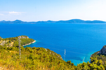 Obraz premium Seascape mountains hills rocks islands turquoise blue water Dalmatia Croatia.