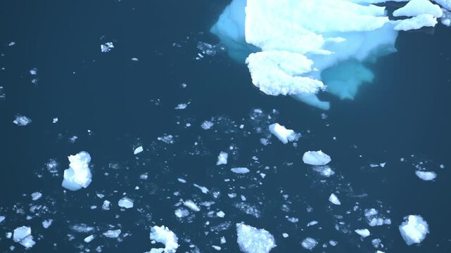 Brash ice from Antarctic icebergs floating past a ship