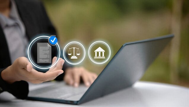 Person using a laptop with icons of legal documents, scales, and buildings.