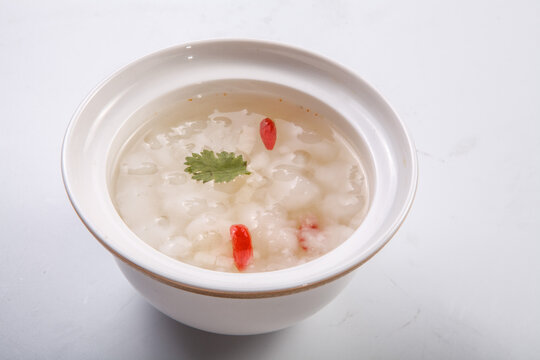 White background of white fungus, goji berries, and snow frog stew